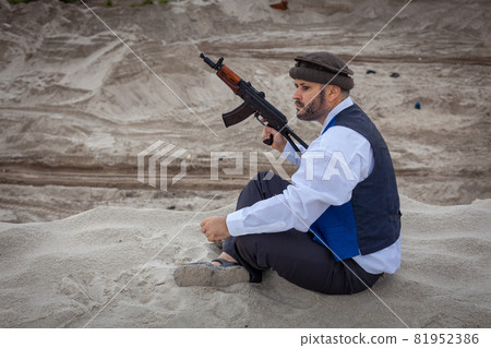 A Taliban soldier monitors a road in Afghanistan. A Taliban soldier monitors a road in Afghanistan. 81952386