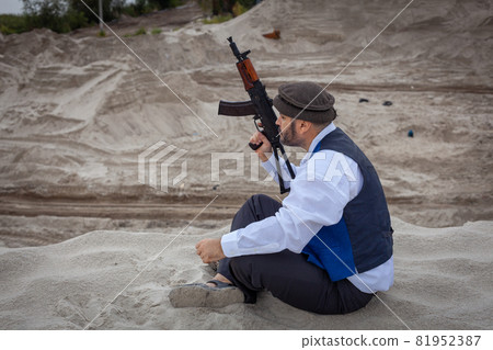 A Taliban soldier monitors a road in Afghanistan. A Taliban soldier monitors a road in Afghanistan. 81952387