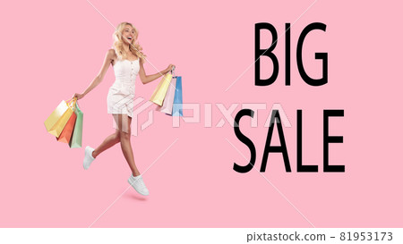 Big Sale. Excited woman jumping with shopping bags Big Sale. Excited woman jumping with shopping bags 81953173