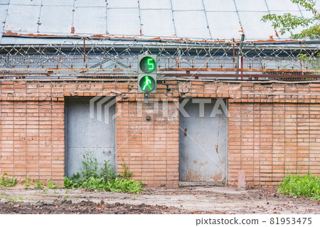 Brick fence with barbed wire. Brick fence with barbed wire. 81953475