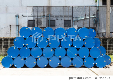 empty recycle blue steel chemical tanks for oil fuel barrels stacked in a row at the factory storage. background and texture 81954393
