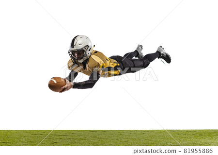 Full-length portrait of professional american football player in special uniform catching a ball isolated over white grass flooring background 81955886