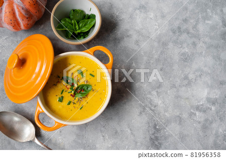 Pumpkin soup made from fresh orange butternut with coconut milk. Delicious vegan, seasonal autumn food. 81956358