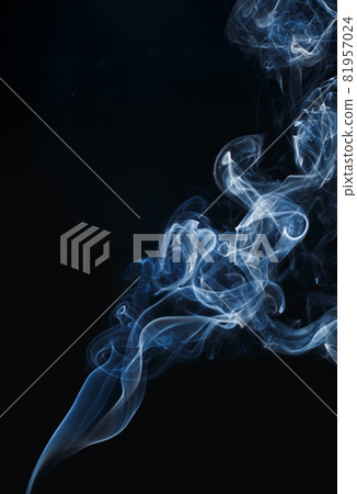 Smoke floating on dark background Smoke floating on dark background 81957024