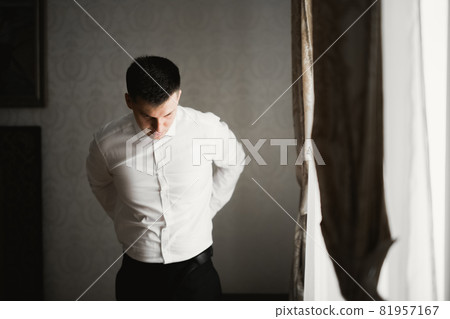 Beautiful man, groom posing and preparing for wedding 81957167