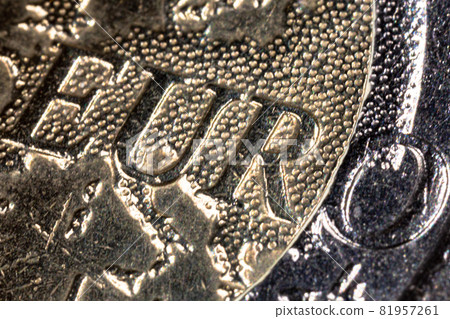 Macro photography of a two euro coin. A sharp detailed capture in high resolution of a 2 euro coin of the ecb. The coin from the front side, a greek coinage. The big euro character in the center Macro photography of a two euro coin. A sharp detailed capture in high resolution of a 2 euro coin of the ecb. The coin from the front side, a greek coinage. The big euro character in the center 81957261