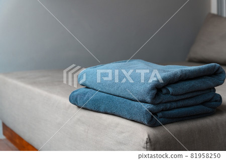 New towels on a sun-bed near a swimming pool. 81958250