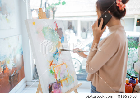 painter artist painting on canvas shoot from her back painter artist painting on canvas shoot from her back 81958516
