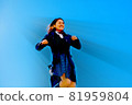 Schoolgirl jumping 81959804