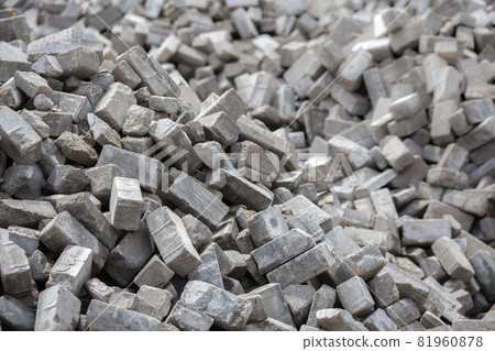 Pile of disassembled gray pavement bricks with selective focus Pile of disassembled gray pavement bricks with selective focus 81960878