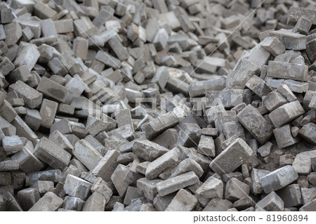 Pile of disassembled gray pavement bricks with selective focus Pile of disassembled gray pavement bricks with selective focus 81960894