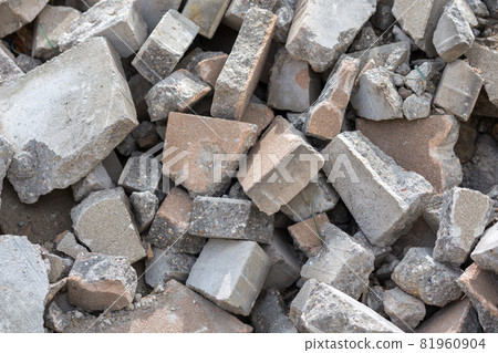 Pile of disassembled gray pavement bricks with selective focus Pile of disassembled gray pavement bricks with selective focus 81960904