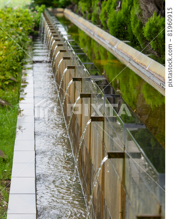 A beautiful waterway in a park where water flows A beautiful waterway in a park where water flows 81960915