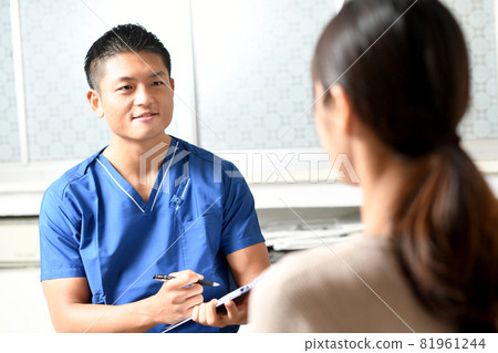 Young male healthcare worker (doctor / doctor) wearing a scrub to interview 81961244