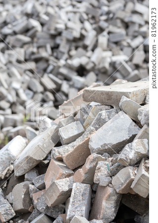 Pile of disassembled gray pavement bricks with selective focus Pile of disassembled gray pavement bricks with selective focus 81962173