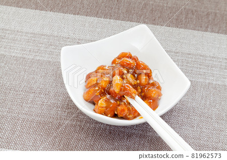 Pinch peanut miso with chopsticks 81962573