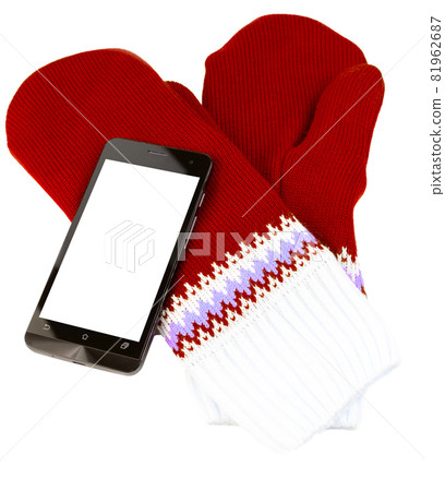 red and white knited mittens with cellphone isolated on white background red and white knited mittens with cellphone isolated on white background 81962687