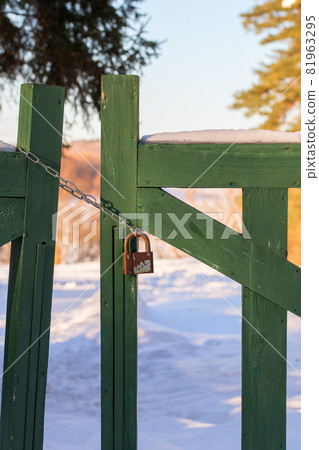 closed wooden gate at winter daylight 81963295