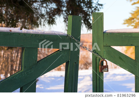 closed wooden gate at winter daylight 81963296