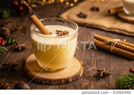 Eggnog with spicy cinnamon for Christmas and winter holidays,Cozy cocktail with milk and cinnamon and clove stars,Traditional Christmas drink with grated nutmeg and cinnamon,Homemade White Holiday Eggnog with spicy cinnamon for Christmas and winter holidays,Cozy cocktail with milk and cinnamon and clove stars,Traditional Christmas drink with grated nutmeg and cinnamon,Homemade White Holiday 81964490