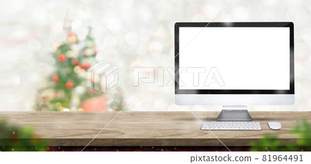 Merry Christmas with blank desktop computer on wood table at blur bokeh xmas tree decor with string light background,Winter banner backdrop for holiday greeting card advertise promotion on online Merry Christmas with blank desktop computer on wood table at blur bokeh xmas tree decor with string light background,Winter banner backdrop for holiday greeting card advertise promotion on online 81964491