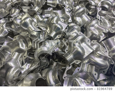 Shiny formed aluminium parts background Shiny formed aluminium parts background 81964789