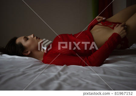 Dreamy alluring woman in red lingerie 81967152