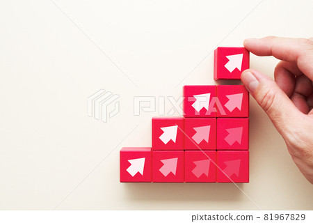 Up arrow and explosive growth. Hands arranging blocks in a staircase pattern. 81967829