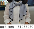 woman wearing achromatic scarf 81968950
