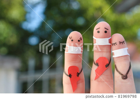 Fingers art of couple in medical mask from COVID-2019. Concept of couple holding broken heart. Fingers art of couple in medical mask from COVID-2019. Concept of couple holding broken heart. 81969798