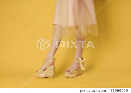 womens shoes beige yellow background posing fashion 81969929