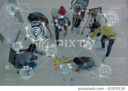 Technology digital virtual screen and Wireless communication connecting over Top view Group Of Asian and diverse Business people brainstorming and helping together in the modern workplace, Technology digital virtual screen and Wireless communication connecting over Top view Group Of Asian and diverse Business people brainstorming and helping together in the modern workplace, 81970130