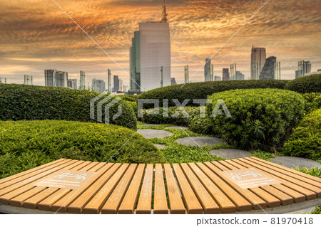PLEASE KEEP YOUR DISTANCE Text on the waiting chair in out door and garden with cityscape background PLEASE KEEP YOUR DISTANCE Text on the waiting chair in out door and garden with cityscape background 81970418