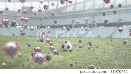 Covid-19 cells against soccer ball on sports stadium Covid-19 cells against soccer ball on sports stadium 81970751