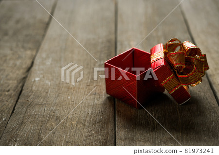 Open christmas presents on wood Open christmas presents on wood 81973241