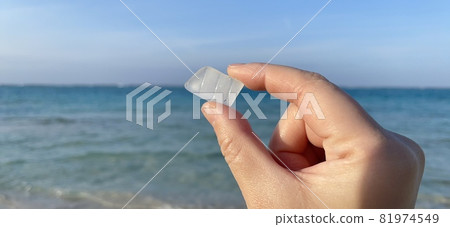 [Marine debris] Fragment of glass that has washed ashore on a beautiful beach Sea glass 81974549