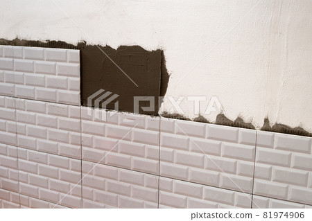 House renovation, Laying ceramic tles on the wall. House renovation, Laying ceramic tles on the wall. 81974906