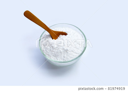 Baking soda in glass bowl on white background. Baking soda in glass bowl on white background. 81974919