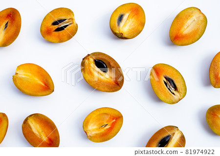 Fresh half sapodilla fruit isolated on white background Fresh half sapodilla fruit isolated on white background 81974922