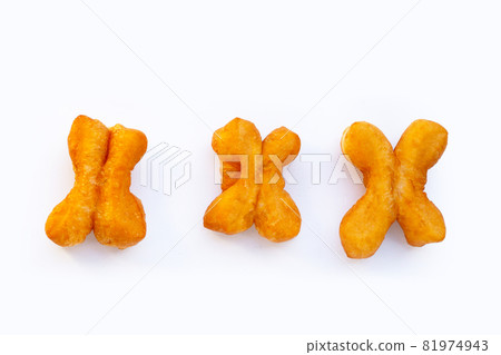Deep-fried dough sticks or chinese bread sticks on white background. Deep-fried dough sticks or chinese bread sticks on white background. 81974943