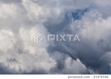 Incoming storm close-up cloudscape at march daylight in continental europe. Captured with 200 mm telephoto lens Incoming storm close-up cloudscape at march daylight in continental europe. Captured with 200 mm telephoto lens 81976586
