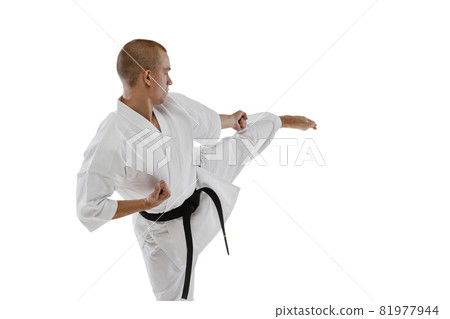 Side view portrait of one caucasian sportsman training isolated over white background. Karate, judo, taekwondo sport 81977944