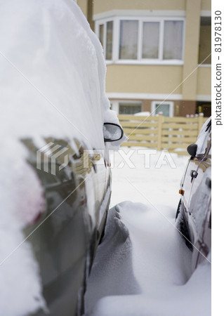 After the snowfall, glass and car mirror in the snow After the snowfall, glass and car mirror in the snow 81978130
