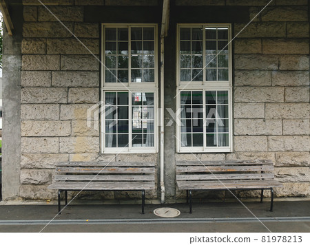 Wooden bench at the old train station 81978213
