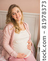 Young attractive pregnant woman on the sofa 81978373