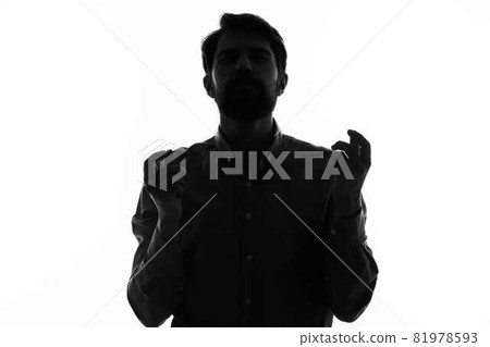 Man Secret agent with a gun in the hands of a crime posing studio Man Secret agent with a gun in the hands of a crime posing studio 81978593