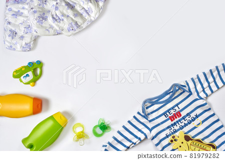 Baby care accessories and clothing on white background, top view Baby care accessories and clothing on white background, top view 81979282