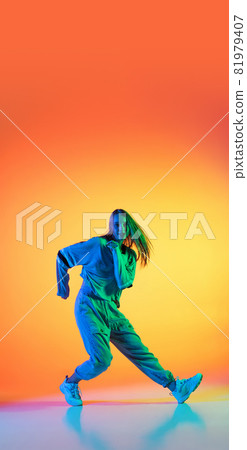 Flyer with young sportive girl dancing hip-hop in stylish clothes on colorful background at dance hall in neon light. Youth culture, movement, style and fashion, action. 81979407