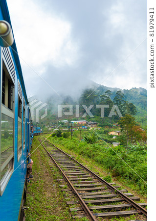 Travel by public train around the island of Sri Lanka. The train travels through mountains and tea plantations. Scenic railway Travel by public train around the island of Sri Lanka. The train travels through mountains and tea plantations. Scenic railway 81979411