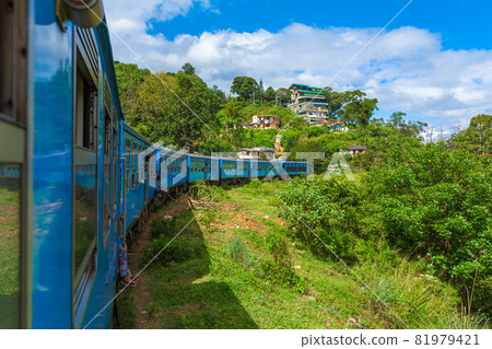 Travel by public train around the island of Sri Lanka. The train travels through mountains and tea plantations. Scenic railway Travel by public train around the island of Sri Lanka. The train travels through mountains and tea plantations. Scenic railway 81979421